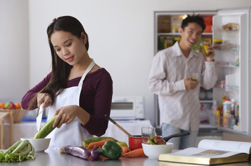 Young couple cooking in the kitchen