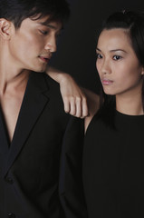 Young couple leaning on each other