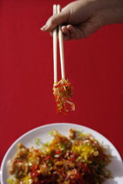 Woman Tossing Raw Fish Salad Also Known As 