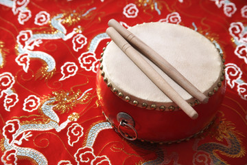 Still life of Chinese drum on Chinese silk fabric