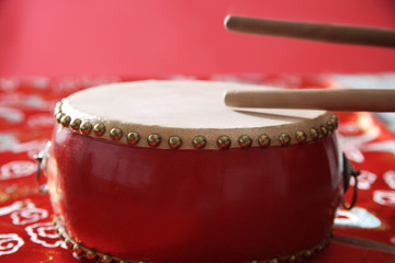 Still life of Chinese drum on Chinese silk fabric