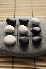 black and white pebbles on zen stone