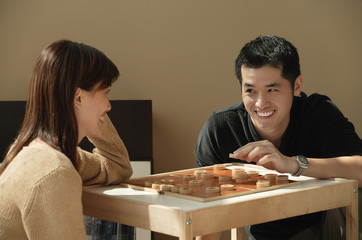 Couple playing board game