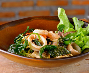 Spaghetti seafood with chili & basil leaf