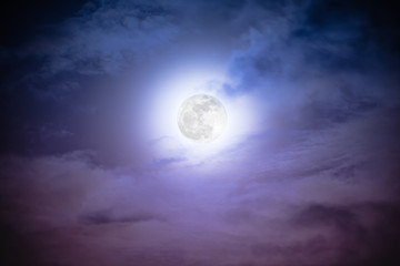 Fototapeta na wymiar Attractive photo of a nighttime sky with clouds and bright full moon. Nightly sky with beautiful full moon. Outdoors at night. The moon were NOT furnished by NASA.