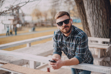 Man with gadget and glasses