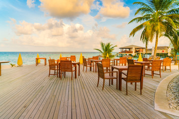 Table and chairs at restaurant in tropical Maldives island .