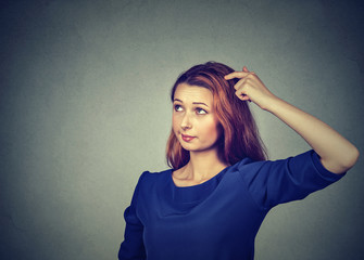 confused thinking woman bewildered scratching head seeks solution