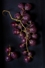 black grape fruit on a black background