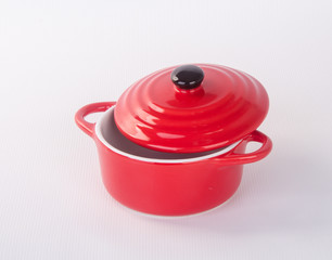 pot or red pot with cover on background.