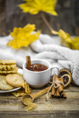 Fototapeta premium delicious cookies and Cup of hot tea with a cinnamon stick