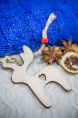 Christmas wooden toys on the background of the sweater