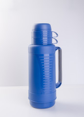 Thermos or Plastic Thermos flask on a background.