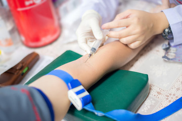 Nurse taking a blood sample for test the health