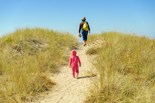 Toddler Walking Behind Mother