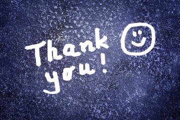 Thank you inscription and smile on the abstract grunge dark navy background