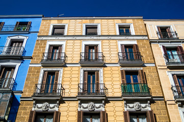 Mediterranean architecture in Spain. Old apartment buildings in famous Calle Mayor in Madrid.