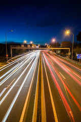 Fototapeta na wymiar Speed Traffic - light trails on motorway highway at night, long exposure abstract urban background