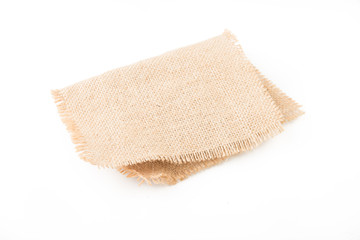 Burlap napkin isolated on white background. Top view.