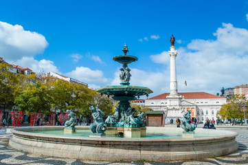Fototapeta premium Fountain on the Rossio square in Lisbon, Portugal