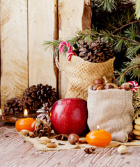 New Year or Christmas composition with walnuts, mulled wine, hazelnuts