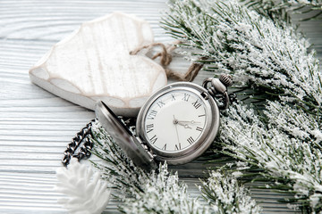 new year on wooden background with watch close up
