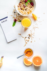 Breakfast with oatmeal and to do list on white background