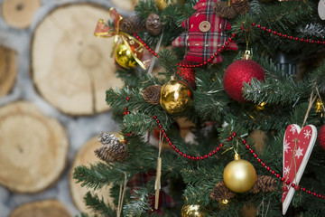 Shiny Christmas balls hanging on pine branches