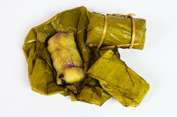 Porridge tie. Sticky rice wrapped in banana leaves, banana banana filling, steamed cooked food.
