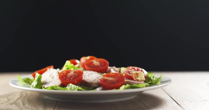 caesar salad closeup falling croutons