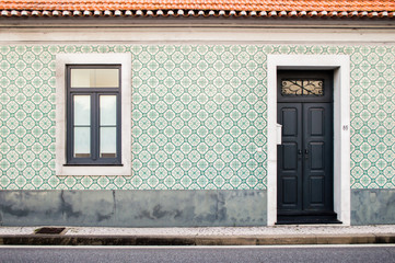 House entrance with typical traditional portuguese tiles on the wall in Portugal