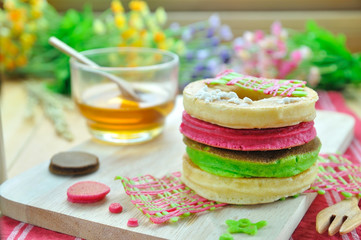 Color pancake set up with honey cup, food concept
