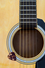 Obraz premium Close up of acoustic guitar with pick