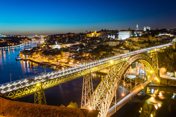Fototapeta na wymiar Porto evening skyline cityscape with Douro River and Dom Luis I Bridge in Porto, Portugal