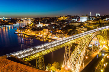 Fototapeta na wymiar Porto evening skyline cityscape with Douro River and Dom Luis I Bridge in Porto, Portugal