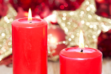 Candles lit with Christmas decorations