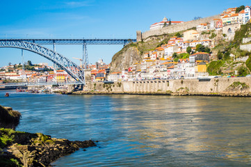 Fototapeta na wymiar Old Porto cityscape skyline with Dom Luis I Bridge and Douro River in Porto, Portugal