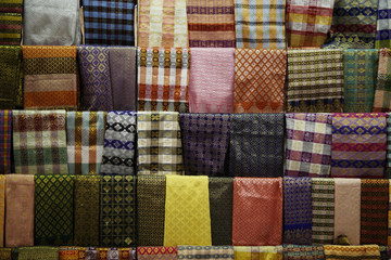 Bright colored sarongs hanging at a market