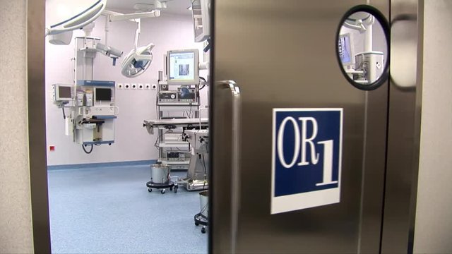 Door to operation room opens and reveal the surgical area