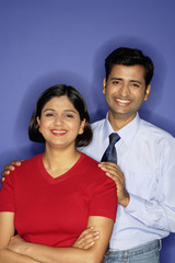 Couple smiling at camera, portrait