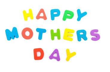 words of happy mothers day shaped by alphabet jigsaw puzzle on white