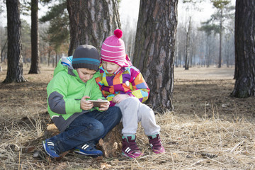 Spring in the forest boy with the girl with delight something co