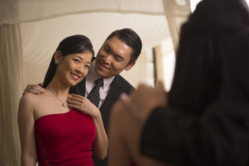 Singapore, Reflection of couple in evening wear in mirror