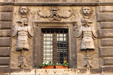 Fototapeta na wymiar Renaissance window with flower pots