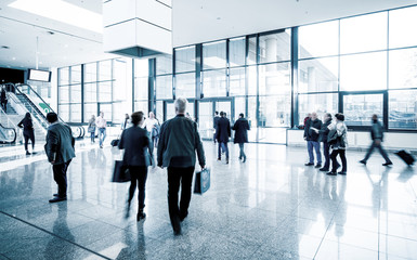 blurred business people trade fair stock photo