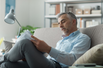 Businessman reading a newspaper