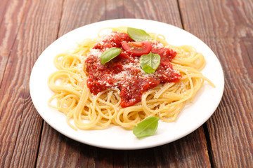 spaghetti with tomato sauce and parmesan