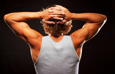 Rear view of healthy muscular young man.