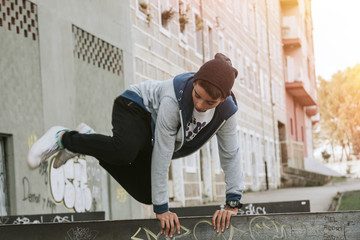 young people practicing parkour in the city