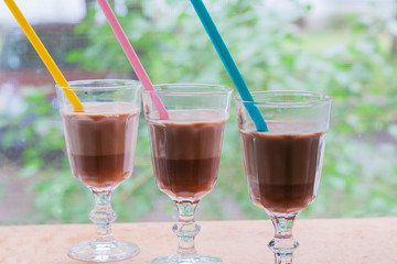 A glass of hot chocolate or latte.